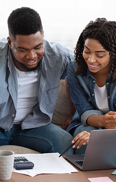 Couple doing finances at laptop