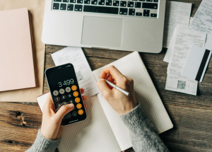 Person using mobile phone as calculator