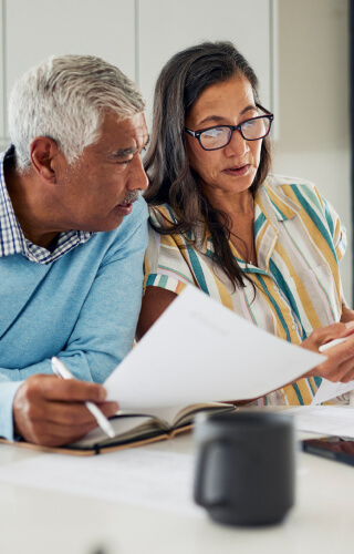 Mature couple reviewing documents