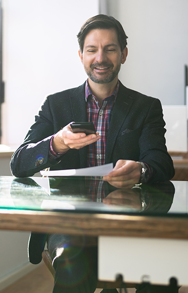 Man depositing a check remotely using his phone