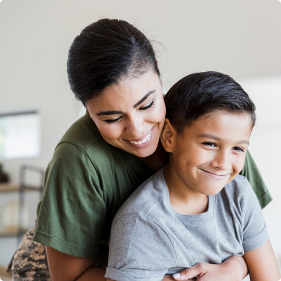 Mother and son embracing