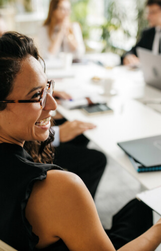 Smiling woman in meeting